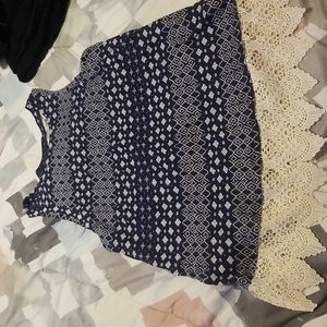 Blue sleeveless tank with cream crochet trim. Laces up back. From Maurices